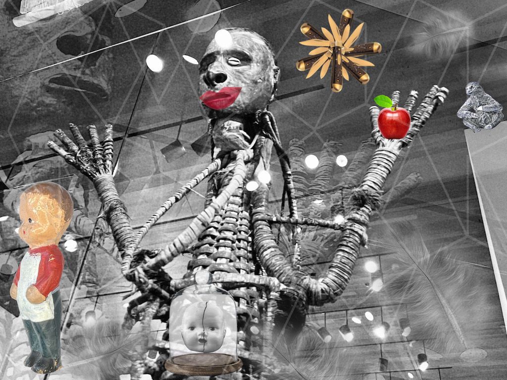 Photo montage showing a doll head in a bell jar, a toy boy, monster with plump red lips, a sloth, a jackknife, and feathers.