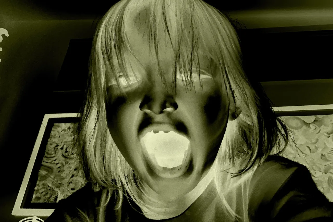 creepy negative image of a child screaming