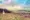 blurred and dreamy soft focus photo of a sign warning of quicksand. the background is a scenic seaside