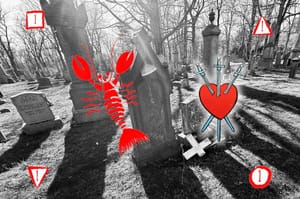 Black and white photo of a cross on the ground at the foot of the gravestone it was once attached to.